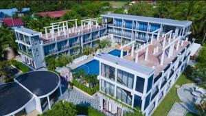an aerial view of a large building with a tennis court at Khemra Boutique in Kampot in Kampot