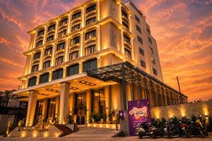 a building with motorcycles parked in front of it at Hotel Accord Premier in Raigarh