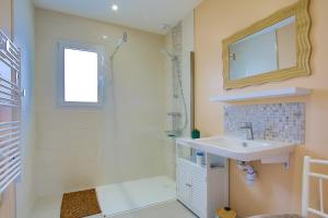 a bathroom with a sink and a shower at La Houle in Créances +37 photos