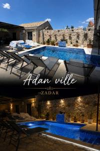 a swimming pool with chairs and a hotel sign at App 2 Ville Adan in Zemuniki