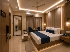 a hotel room with a bed and a table at Hotel Luxe Elite IGI Delhi in New Delhi