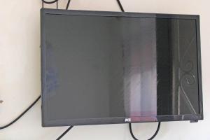 a flat screen tv hanging on a wall at Kolstar Hotel SMC Ltd in Ogwam