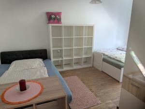 a small room with a bed and a table at Appartement Julis 1 in 3430 Tulln in Tulln