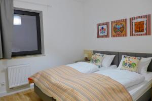 Posteľ alebo postele v izbe v ubytovaní Wellness Apartamenty Złoty Widok