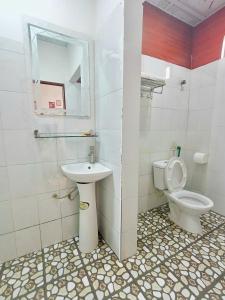 a bathroom with a toilet and a sink at Nấm Homestay in Sapa +27 photos