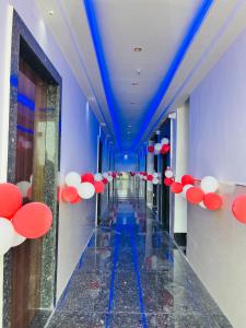a hallway with red and white umbrellas on the ceilings at Hari Kamal Invitation in Mathura