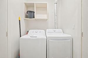 a small laundry room with a washer and dryer at Riviera Dunes 501 in Perdido Key