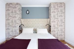 a bedroom with a large bed with two pillows at Views Spacious Villa in El Rincón
