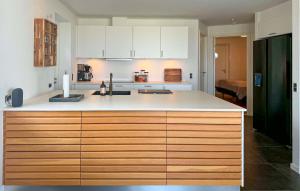 a kitchen with white cabinets and a white counter top at Awesome Home In Haderslev With Sauna in Haderslev