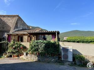 a house with a refrigerator in front of it at Rafael in Quintillan