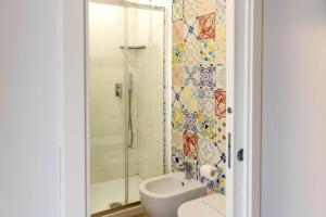 a bathroom with a shower and a toilet and a sink at Villa Cua in Ercolano +86 photos