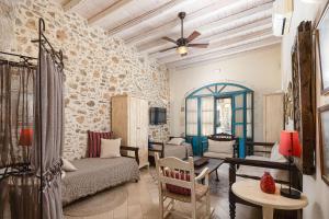 a living room with a couch and a table at Villa Aposperitis in Panormos Rethymno
