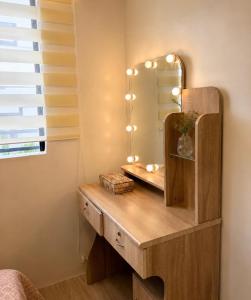 a dressing table with a mirror in a room at Casa Aelliah in General Santos