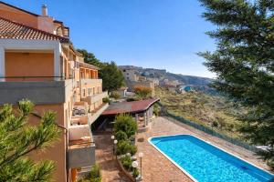 an external view of a house with a swimming pool at Santangelo in Monte SantʼAngelo