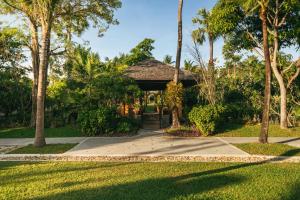 a gazebo in a park with palm trees at Bandara Spa Resort & Pool Villas, Samui in Bophut