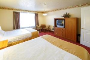 Postel nebo postele na pokoji v ubytování Murphys Suites