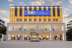 a store front of a building with a sign on it at FabHotel Vaishnavi Classic in Secunderabad