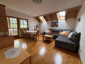 a living room with a couch and a table at Appartements Else in Ortisei