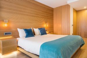 Ένα ή περισσότερα κρεβάτια σε δωμάτιο στο Almada Domus