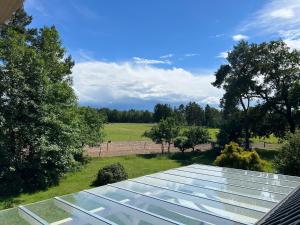 a group of glass panels on the roof of a house at Natur & Ruhe in Worpswede