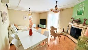 a living room with a couch and a fireplace at Villa Mansa in Pechina