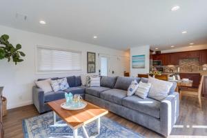 a living room with a couch and a table at Beautiful Remodel 3 Bedroom 2 bathroom Home with Pool & Jacuzzi in Fullerton