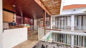 an open kitchen and dining area of a house at Agung Guest house Canggu in Dalung