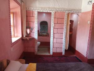 a room with a bathroom with a toilet in it at Dar Laayoune in El Kelaa des Mgouna +51 photos