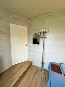 a room with a bed in a room with a wall at Liiva Guest Accommodation,free parking in Tartu