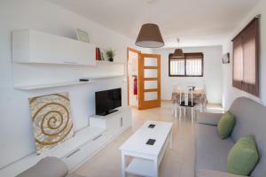 a living room with a couch and a fireplace at Casa de Los Maestros in Bicorp