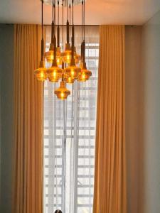 a chandelier is hanging in front of a window at Nalim bliss garden in Ruiru