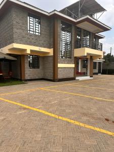 an empty parking lot in front of a building at Nalim bliss garden in Ruiru