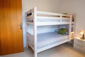 a bedroom with two bunk beds in a room at Casa de Los Maestros in Bicorp