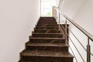 a stair case in a building with a window at FabHotel Palak Palace in Jaipur