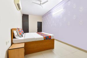a bedroom with a bed in a room at FabHotel Palak Palace in Jaipur +23 photos