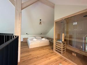 a bedroom with a bed and a glass wall at Glamping resort Dolenjc in Novo Mesto +15 photos