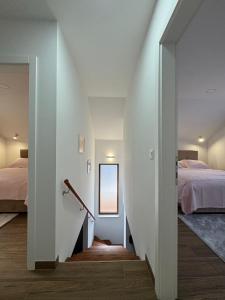 a hallway leading to a bedroom with two beds at Kuća za odmor Bruna in Livno