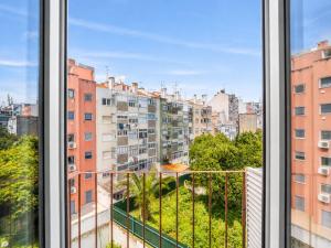 a view from a window of a city at The Twenties by GuestReady in Lisbon +91 photos