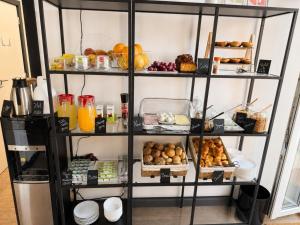 a shelf filled with lots of different types of food at The Twenties by GuestReady in Lisbon