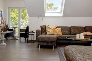 a living room with a couch and a table at Ferienwohnung Rafaela in Zinnowitz