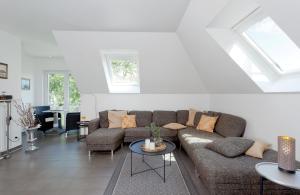 a living room with a couch and a table at Ferienwohnung Rafaela in Zinnowitz +23 photos