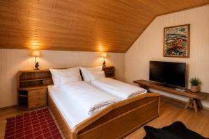 Llit o llits en una habitació de Frein Chalets - Wildalm
