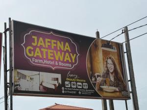 a billboard sign for a car show with a woman at Jaffna Gateway Hotel and Restaurant in Kanakarayankulam +8 photos
