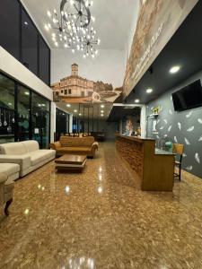 a large living room with couches and a bar at Baan Phu Place in Ban Suan