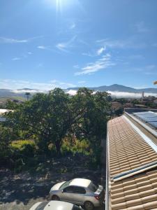 a view of a parking lot with cars parked at Felício Reis - Pousada Colonial in Conceição do Mato Dentro