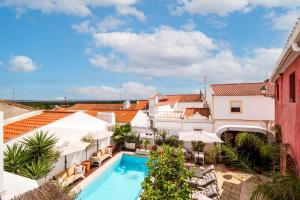 an aerial view of a hotel with a pool and buildings at Quarto Duplo - Pacote Alentejo 3 Noites in Alcáçovas
