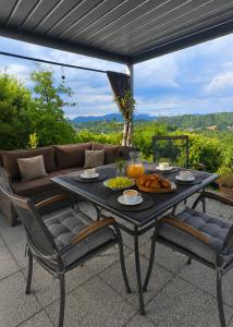 a table with food on it on a patio at Relax House Lara in Krapinske Toplice in Krapinske Toplice