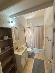 a bathroom with a sink and a toilet and a shower at Stergios Apartment Evdilos Ikaria in Evdilos +36 photos