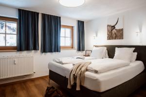 Katil atau katil-katil dalam bilik di Berghotel Basur +106 gambar