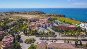 an aerial view of a resort with the ocean in the background at Cascade Wellness Resort Lagos Algarve by Domes in Lagos